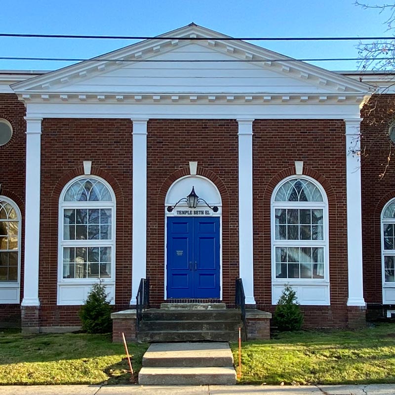 front of building with blue door